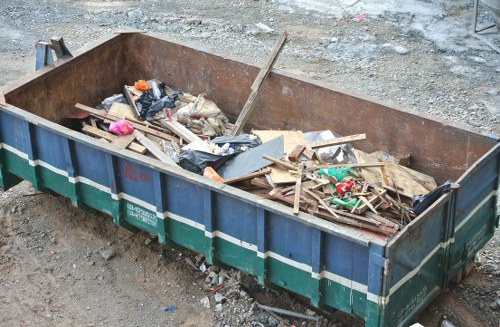 Construction site with builders clearing waste